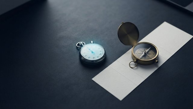Stopwatch and a compass resting on a printed project timeline broken into three phases