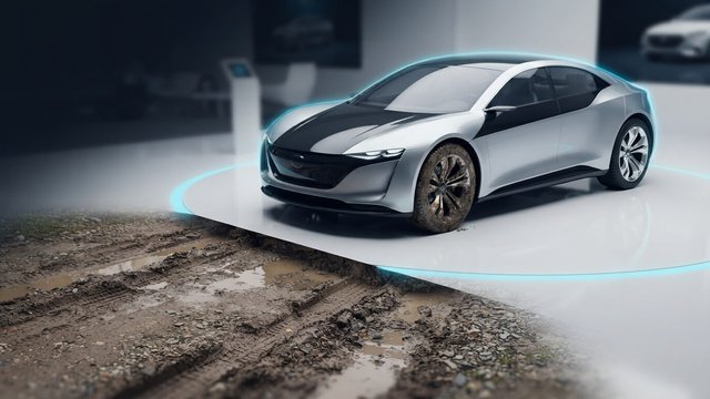 A sleek silver concept car on a glowing cyan showroom turntable, its muddy wheels reaching onto a rough dirt track beyond the platform