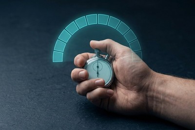 Hand holding a stopwatch under a glowing cyan arc of twelve segments, one for each week from MVP to V1